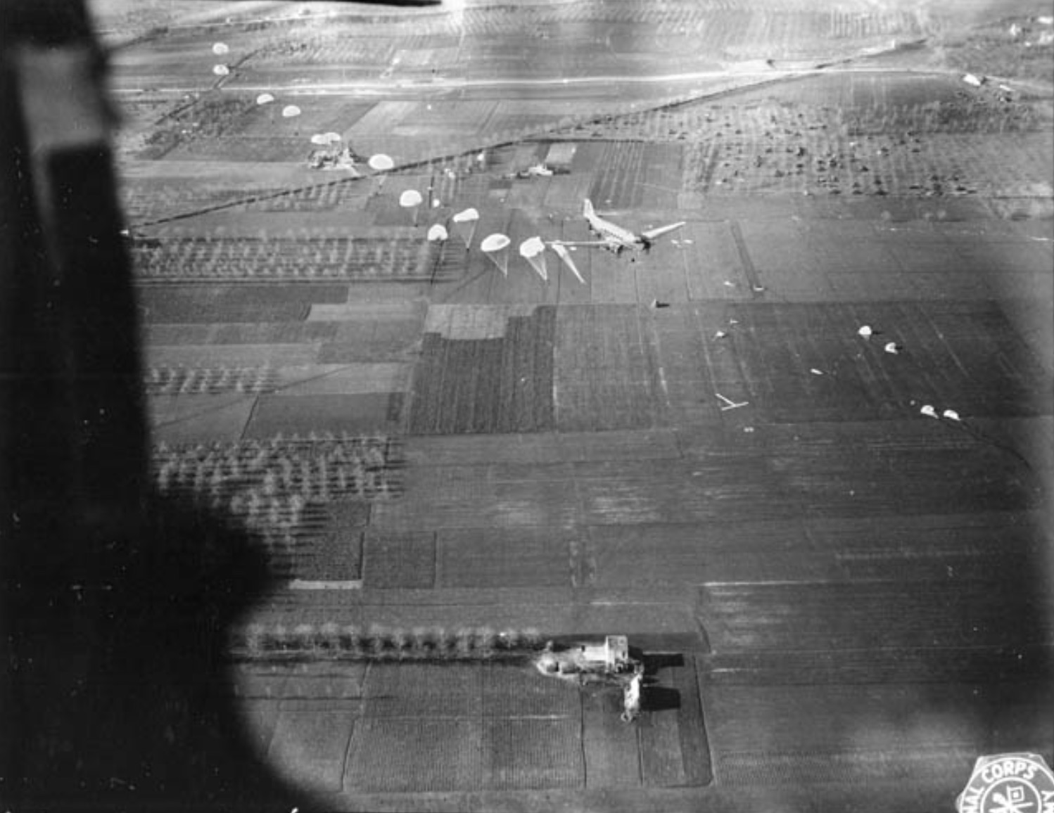 A stick of paratroopers on D-Day hit the silk over Europe 